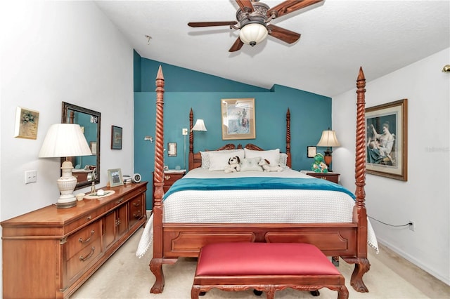 bedroom featuring light carpet, a textured ceiling, vaulted ceiling, and ceiling fan