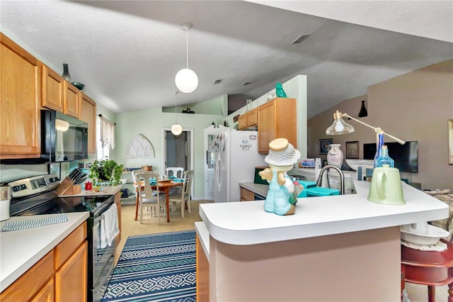 kitchen featuring a kitchen bar, vaulted ceiling, stainless steel electric stove, white refrigerator with ice dispenser, and decorative light fixtures