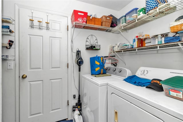 clothes washing area featuring washing machine and dryer