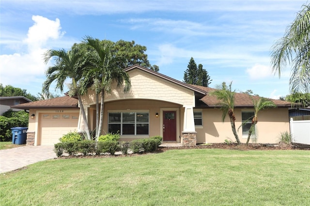 ranch-style home with a front yard and a garage