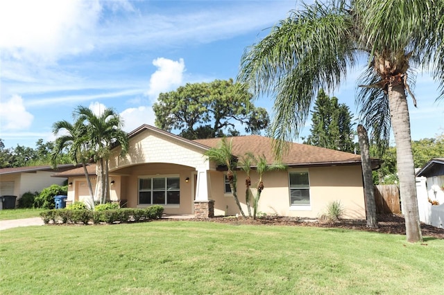 single story home with a front yard