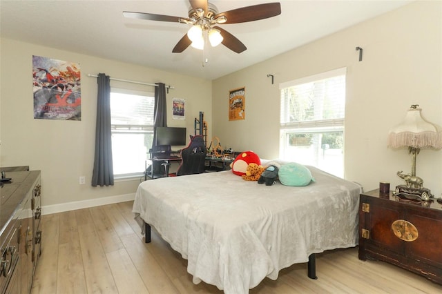 bedroom featuring ceiling fan and light hardwood / wood-style floors