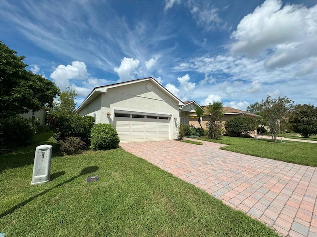 view of side of property featuring a lawn and a garage