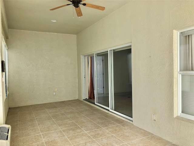 view of patio featuring ceiling fan