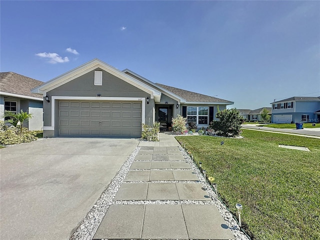 ranch-style home featuring a front lawn and a garage