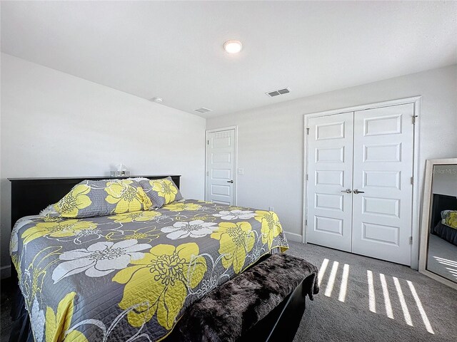 carpeted bedroom with a closet