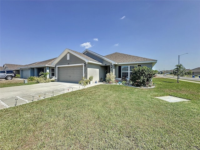 view of front of home with a garage and a front lawn