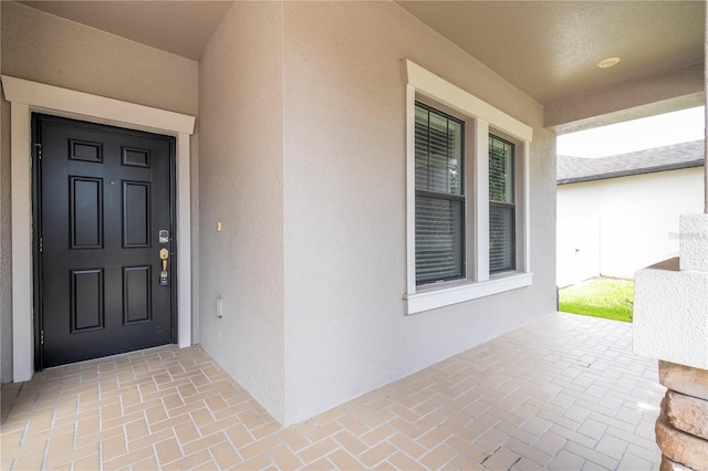 doorway to property featuring a porch