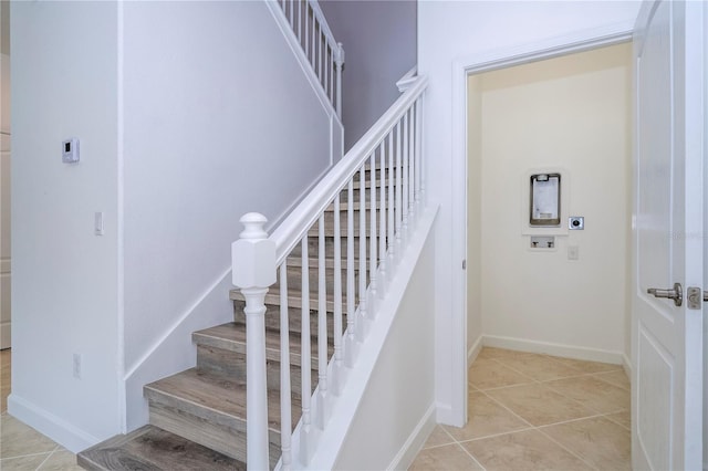 stairway featuring tile patterned floors