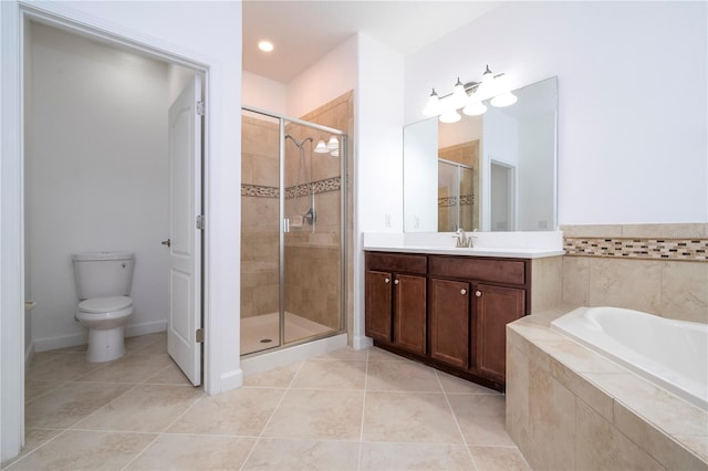 full bathroom featuring tile patterned floors, separate shower and tub, vanity, and toilet