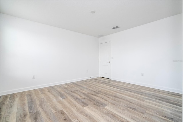 unfurnished room featuring light wood-type flooring