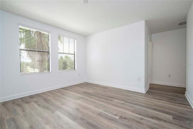 spare room with light wood-type flooring