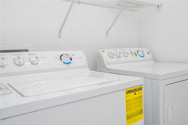 washroom featuring washer and dryer