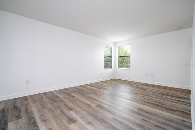 spare room featuring hardwood / wood-style flooring