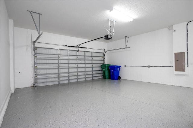 garage with electric panel and a garage door opener