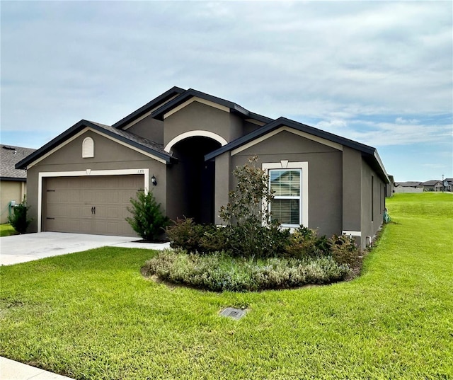 view of front facade with a front lawn and a garage