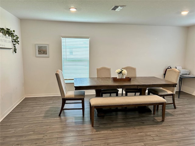 dining space featuring hardwood / wood-style flooring