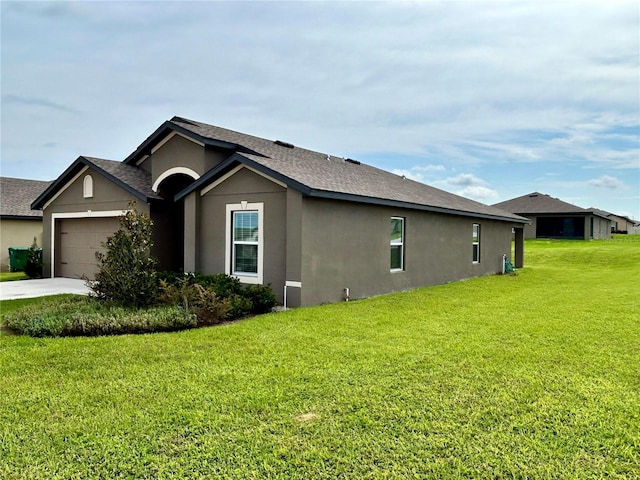 exterior space featuring a garage and a front lawn