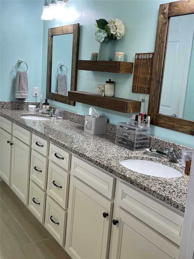 bathroom with tile patterned flooring and vanity