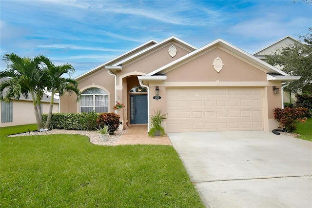 single story home with a garage and a front lawn