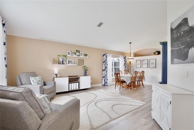 living room with light hardwood / wood-style flooring