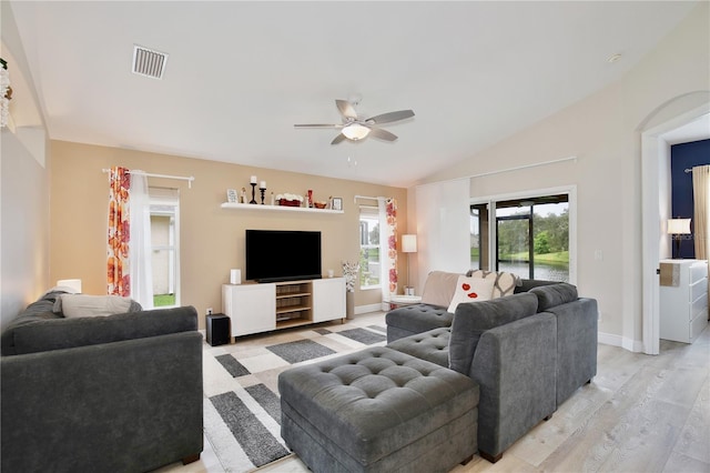 living room with lofted ceiling, ceiling fan, and light hardwood / wood-style flooring