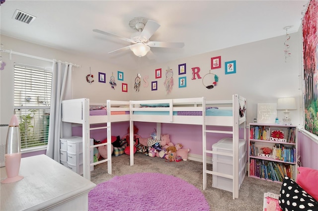 bedroom with ceiling fan and light colored carpet