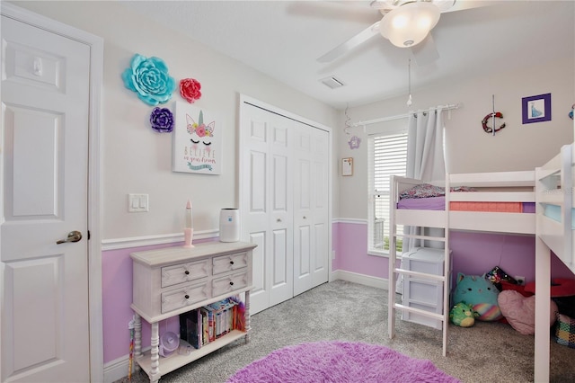 carpeted bedroom featuring a closet and ceiling fan