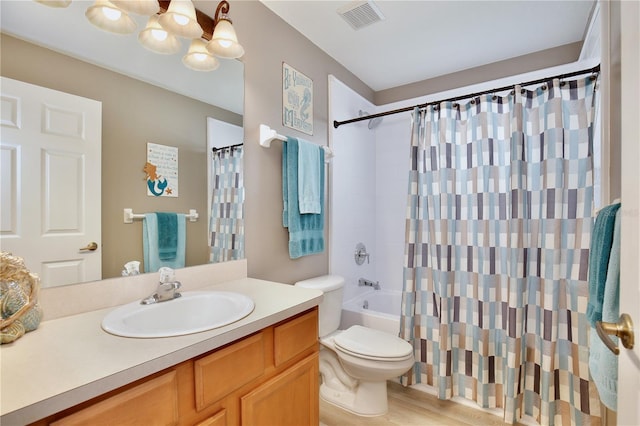 full bathroom featuring wood-type flooring, vanity, toilet, and shower / bath combo