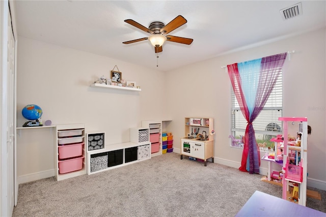 recreation room with ceiling fan and carpet flooring