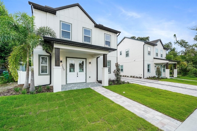 view of front of property with a front yard and a porch