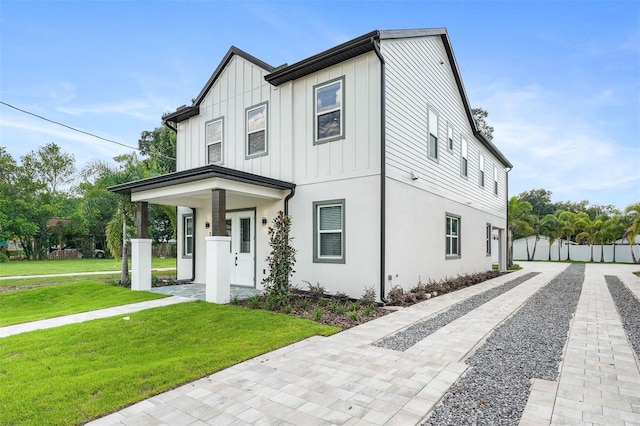 modern farmhouse with a front yard