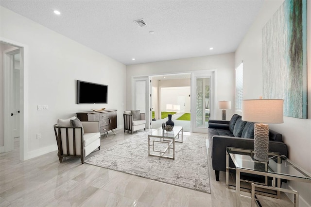 living room with a textured ceiling