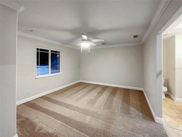 carpeted empty room featuring ornamental molding and ceiling fan