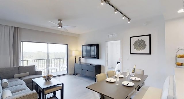 living room featuring rail lighting and ceiling fan