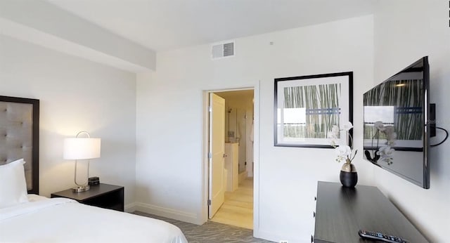 bedroom featuring hardwood / wood-style floors