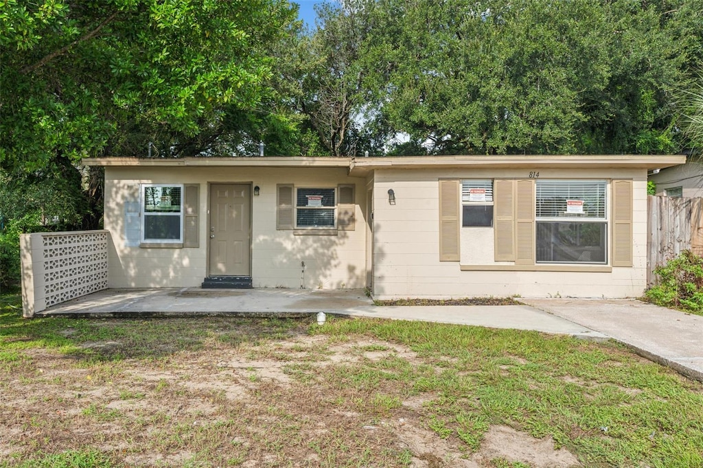 view of front facade with a front yard and a patio area