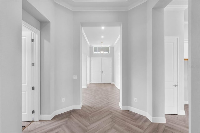 hall with ornamental molding and light parquet flooring