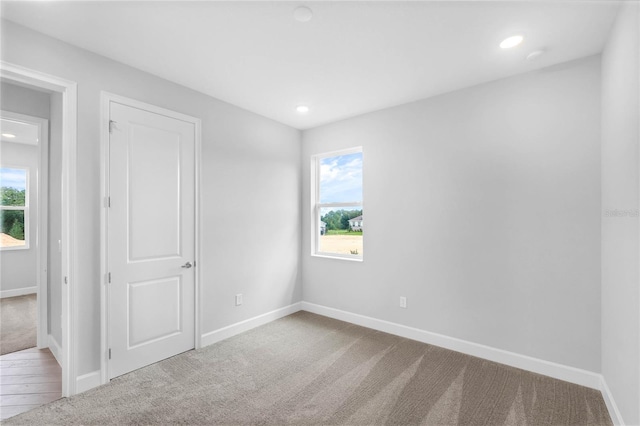 unfurnished room featuring carpet