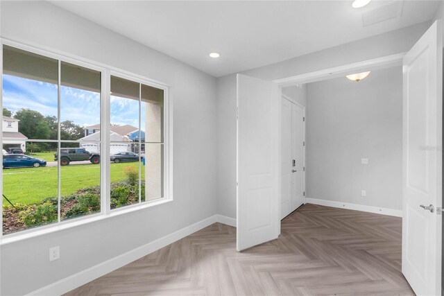 spare room with parquet flooring