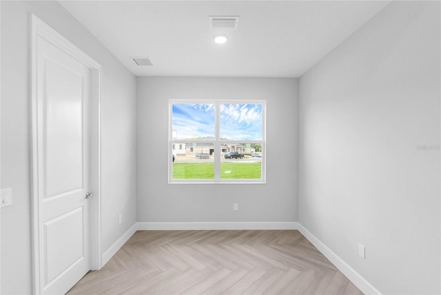 empty room with light parquet floors