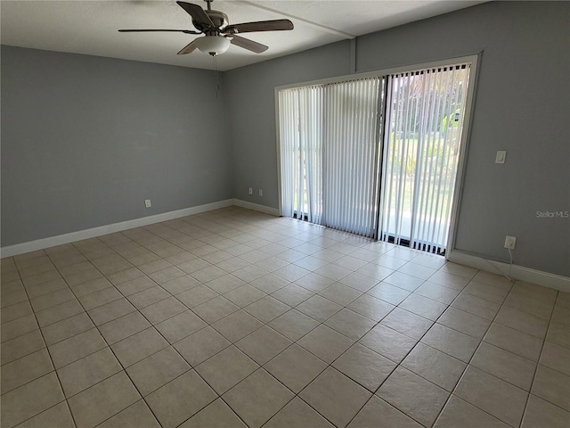 tiled spare room with ceiling fan