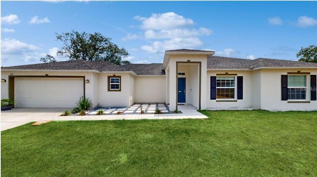 view of front facade featuring a garage and a front yard