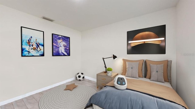 bedroom with light hardwood / wood-style flooring