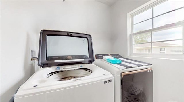 laundry area with separate washer and dryer