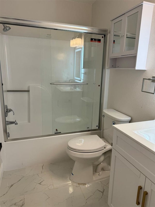 full bathroom featuring vanity, toilet, and enclosed tub / shower combo