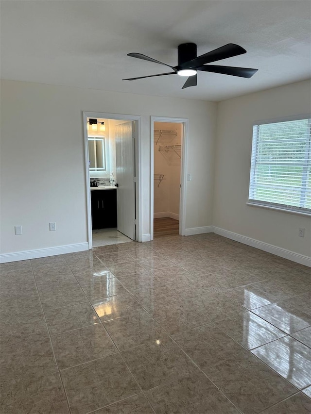 unfurnished room featuring ceiling fan