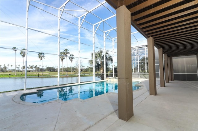 view of pool featuring a lanai, a patio area, and a water view