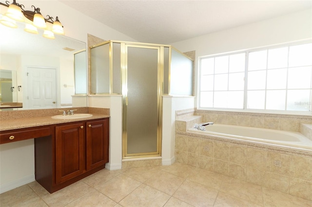 bathroom with plus walk in shower, vanity, and tile patterned floors