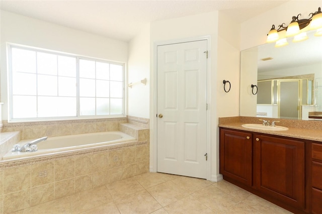 bathroom with tile patterned floors, plus walk in shower, and vanity